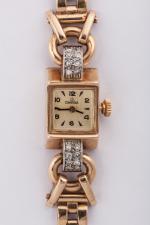 OMEGA . MONTRE BRACELET de dame, or, sertie de diamant....