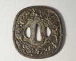 JAPON. TSUBA en fer à décor de chien et de...