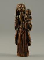 VIERGE à l'ENFANT en buis sculpté. XVIème. Haut. 14 cm...