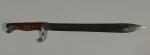 BAIONETTE Mauser 1898-05. Poignée à plaquettes de bois. Lame à...